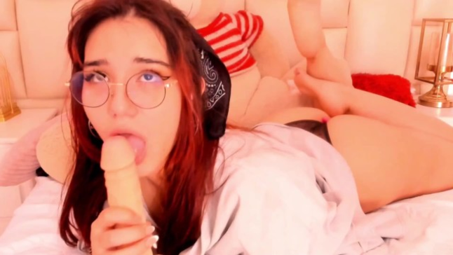 AngieStar69's glasses fog up as she deep-throats a rubber salami for your viewing gusto